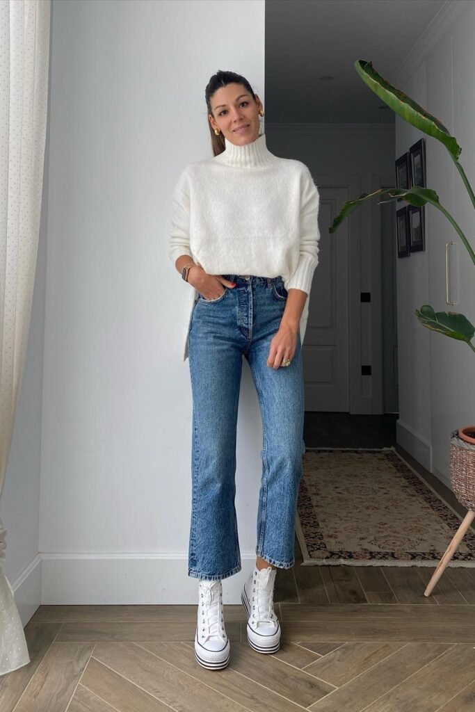 White Turtleneck Sweater + Medium Wash Straight Jeans + White Platform Sneakers