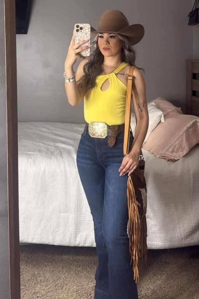 Yellow Cut-Out Halter Top + Dark Wash Flare Jeans + Brown Cowboy Hat