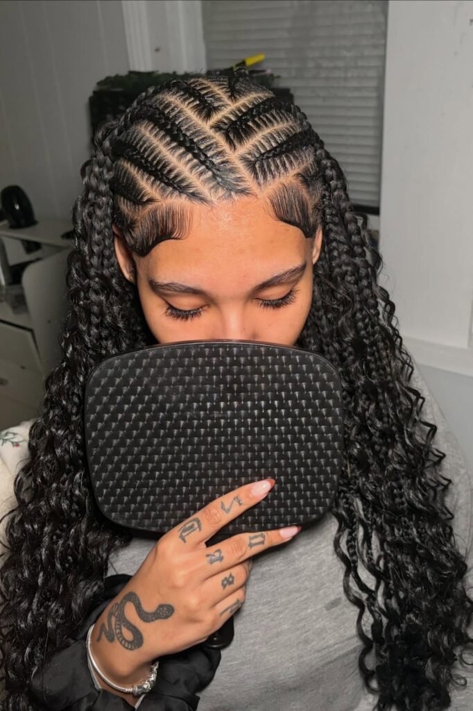 Zig-Zag Parted Cornrows with Long Curly Ends