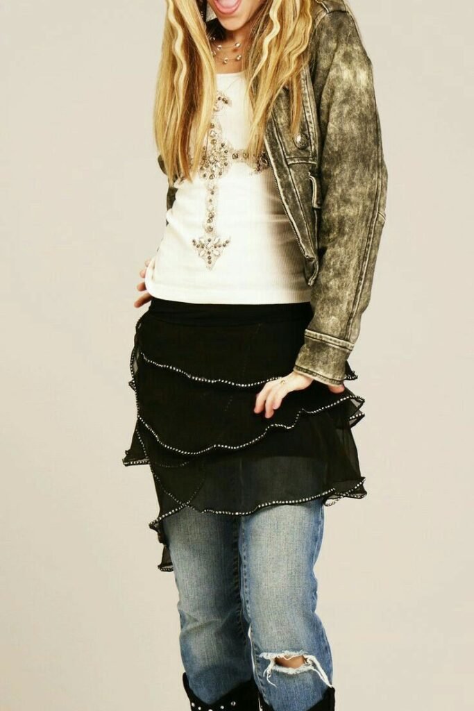 Acid Wash Jacket + Black Tiered Skirt Over Jeans + Black Boots