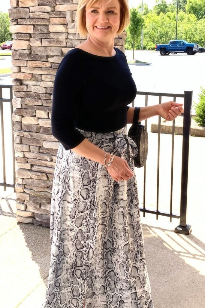 Black Boatneck Top + Snake Print Maxi Skirt + Black Circular Bag