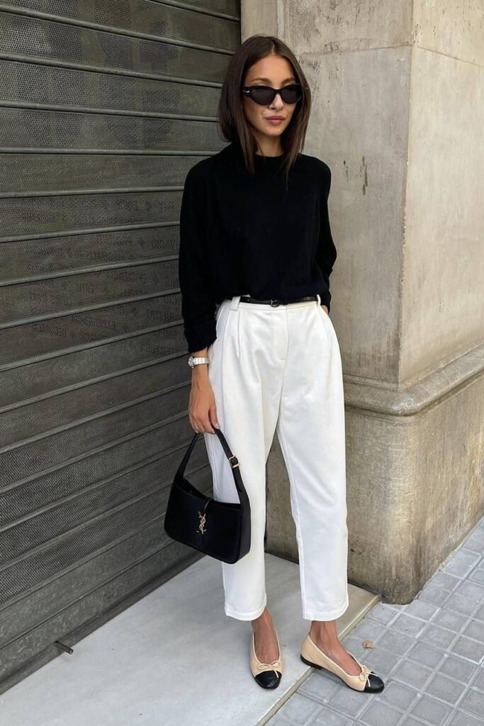 Black Crewneck Sweater + White Pleated Trousers + Beige and Black Cap Toe Ballet Flats