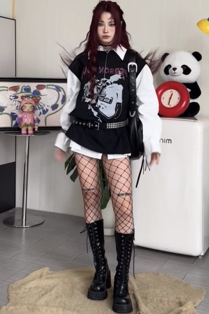 Black Graphic Sweatshirt + White Collared Shirt + Fishnet Tights + Black Combat Boots