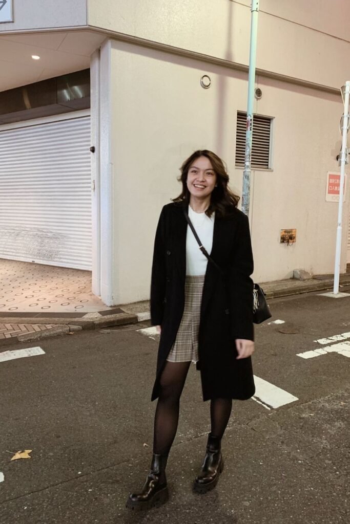 Black Long Coat + White Top + Plaid Mini Skirt + Black Tights + Black Chunky Boots
