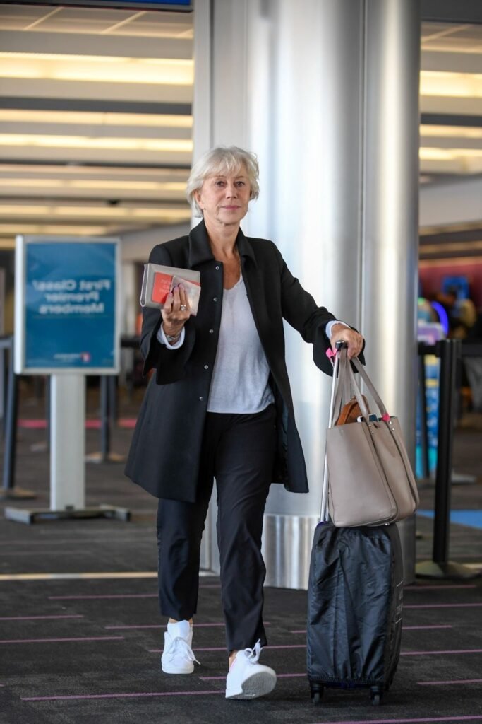 Black Mid Length Coat + White V Neck Tee + Black Trousers + White Sneakers