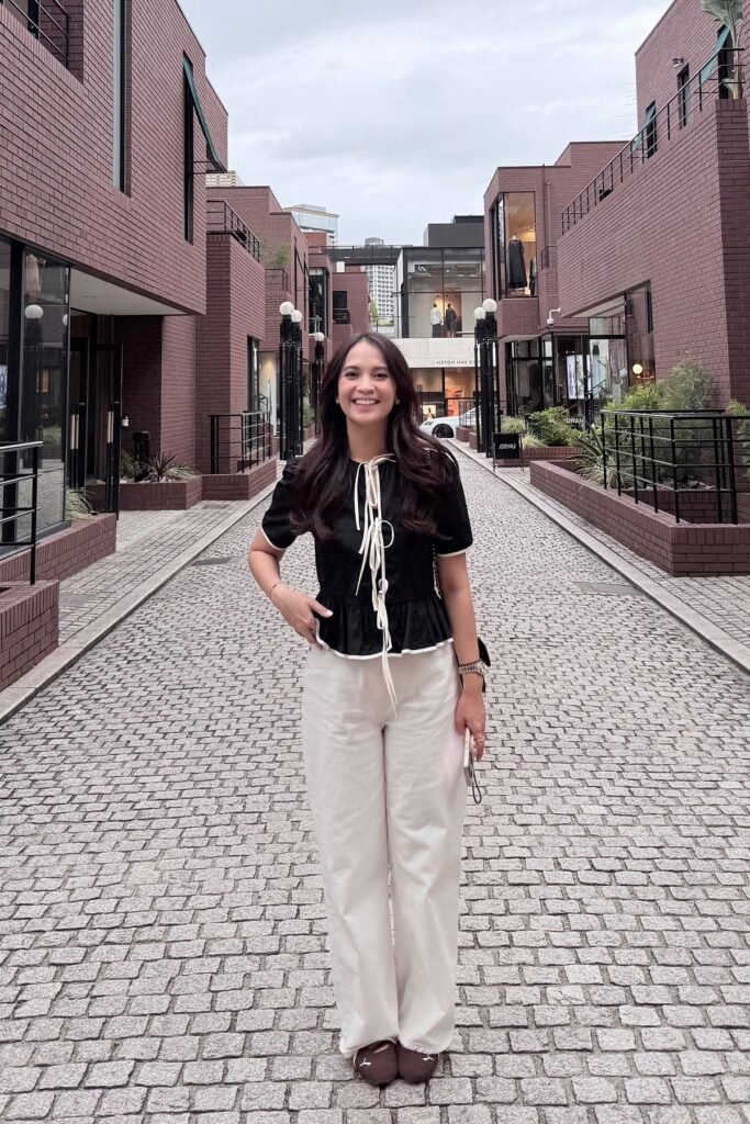 Black Peplum Blouse with White Trim + White Wide Leg Pants + Brown Ballet Flats
