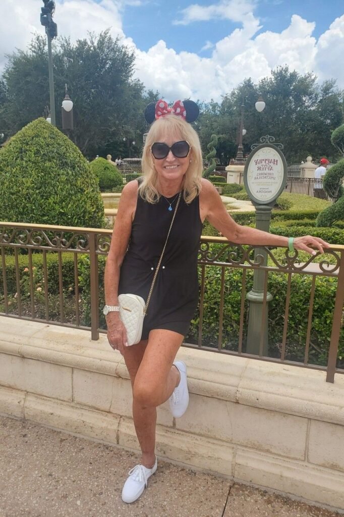 Black Sleeveless Minidress + White Canvas Sneakers + Red Polka Dot Mickey Ears