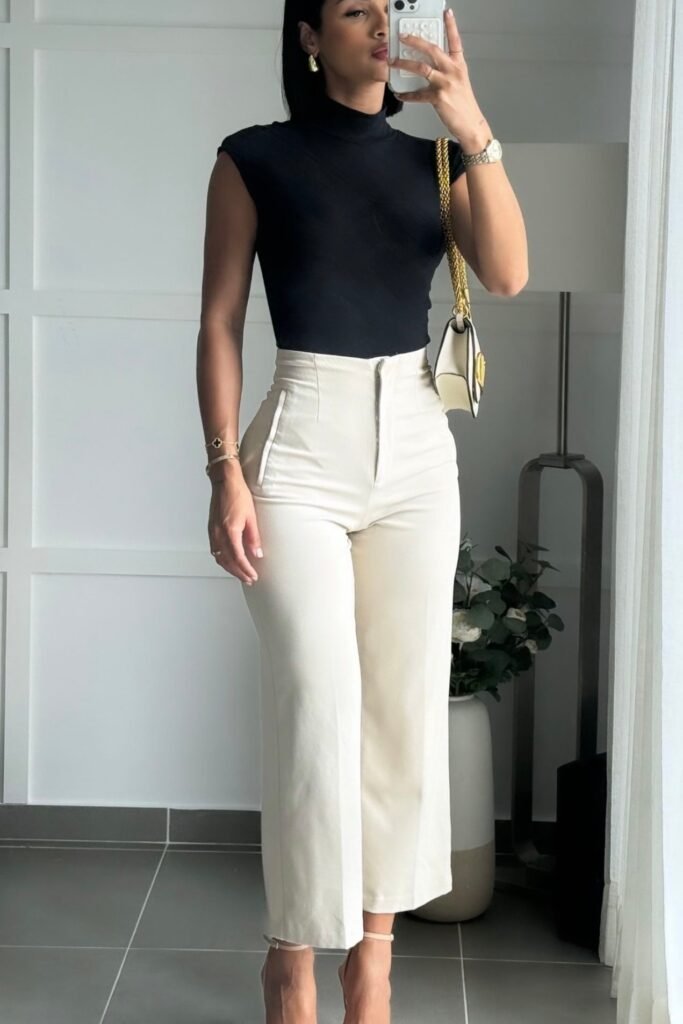 Black Sleeveless Mock Neck Top + Off White High Waisted Wide Leg Trousers + Gold Chain Shoulder Bag + Nude Ankle Strap Heels