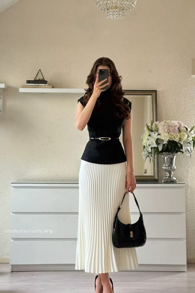 Black Sleeveless Turtleneck Top + Black Waist Belt + White Pleated Maxi Skirt + Black Pumps