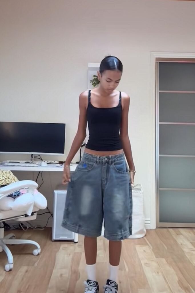 Black Tank Top + Extra Baggy Denim Jorts + Black & White Skate Shoes