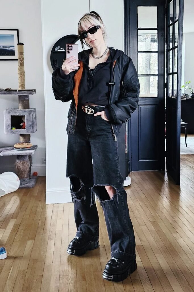 Black Zip Up Hoodie + Black Bomber Jacket + Ripped Wide Leg Black Jeans + Chunky Black Sneakers