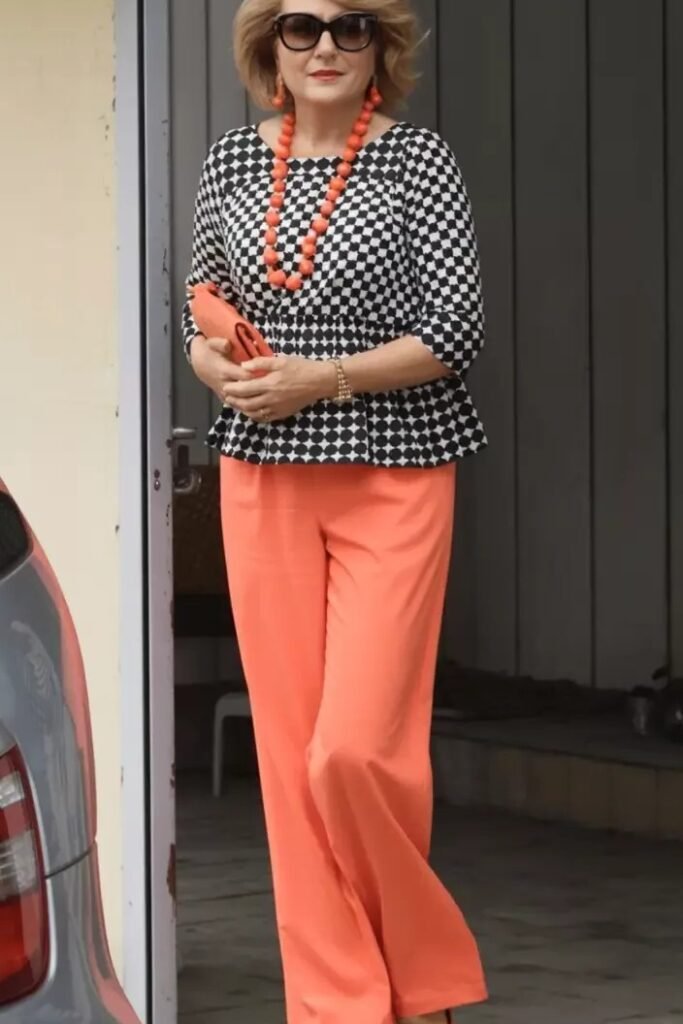 Black and White Patterned Peplum Top + Coral Wide Leg Pants + Coral Statement Necklace