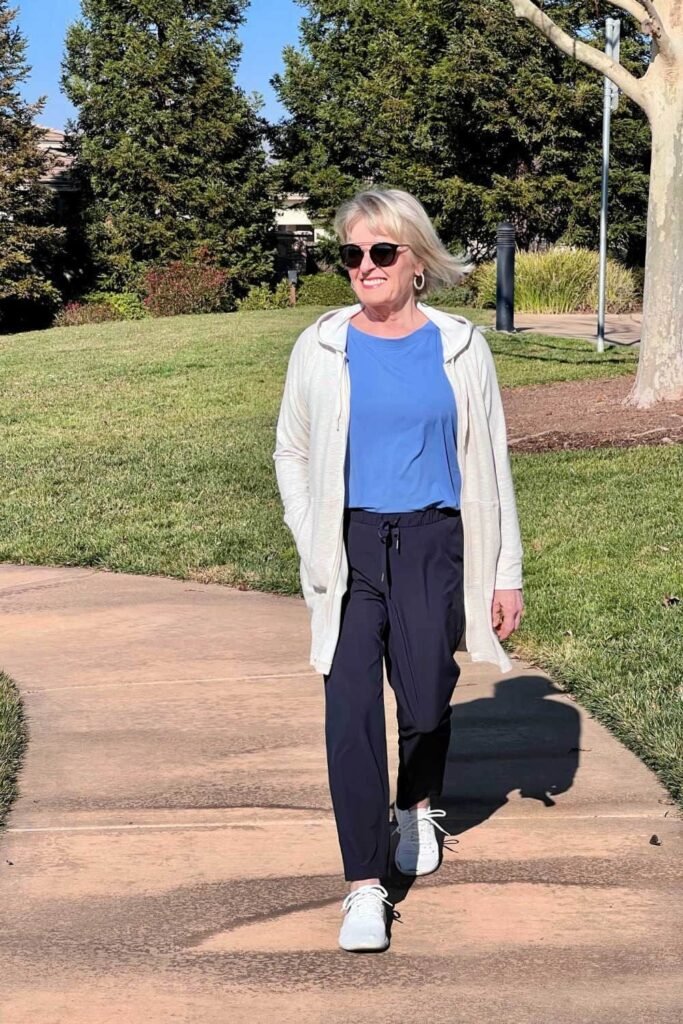 Blue Crewneck Tee + Cream Hooded Cardigan + Navy Tapered Joggers + White Athletic Shoes