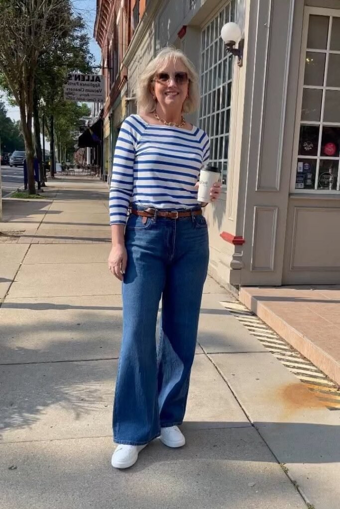 Blue and White Breton Top + Dark Wash Flared Jeans + White Sneakers