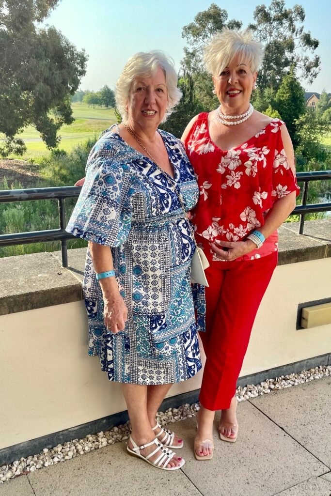Blue and White Patterned Wrap Dress + White Strappy Sandals & Red Floral Blouse + Red Trousers + Clear Heels