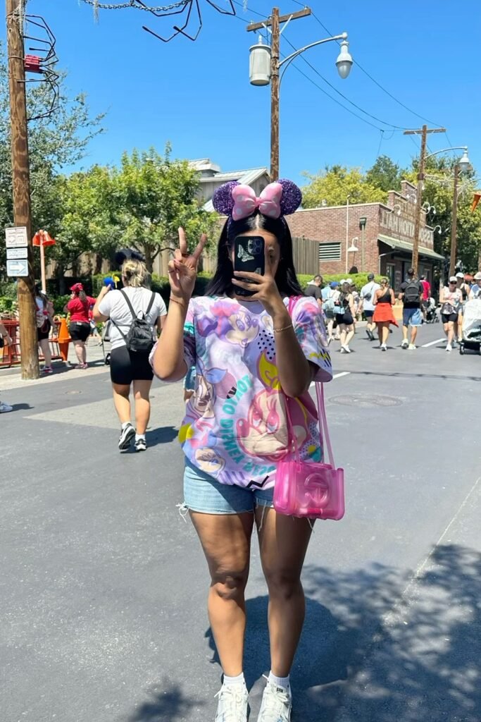 Colorful Minnie Mouse Graphic Tee + Denim Shorts + Pink Transparent Bag + White Sneakers