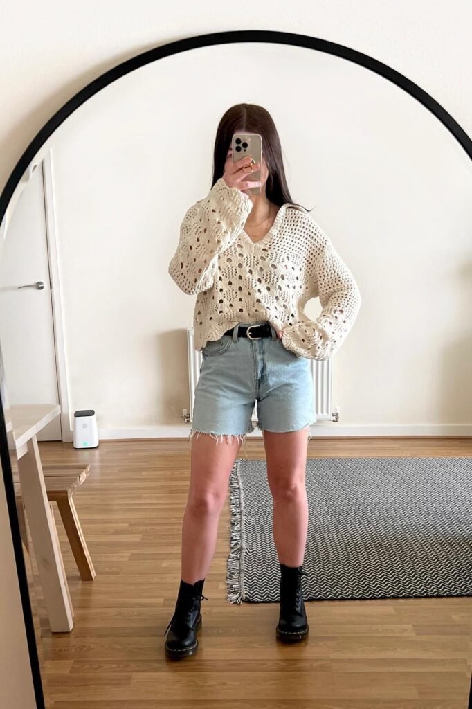 Cream Crochet Open Knit Sweater + Light Wash Denim Shorts + Black Lace Up Combat Boots