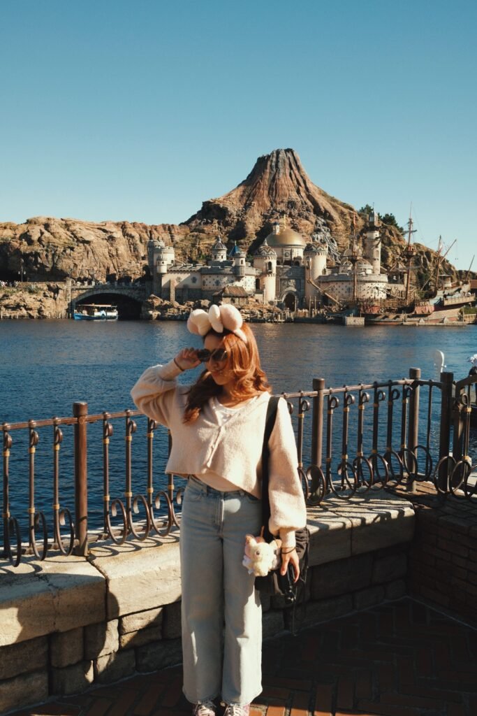 Cream Cropped Cardigan + Light Wash Straight Jeans + White Sneakers