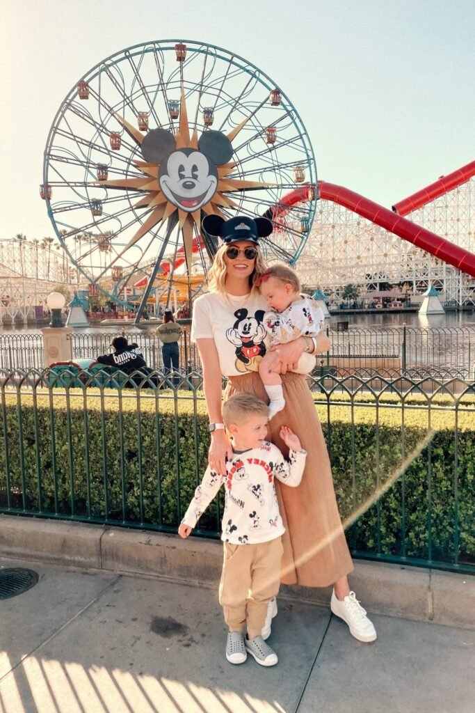 Cream Mickey Mouse Graphic T Shirt + Tan Wide Leg Pants + White Sneakers