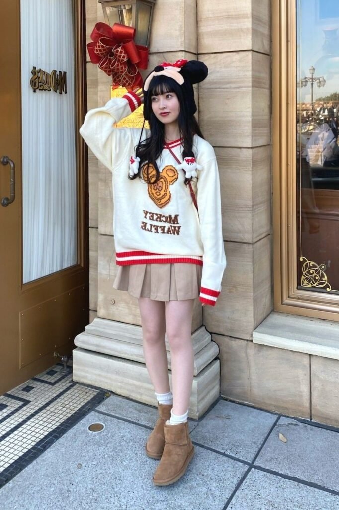 Cream Mickey Waffle Sweater + Beige Pleated Mini Skirt + Brown Ugg Boots