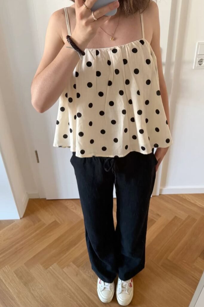 Cream Polka Dot Babydoll Camisole + Black Wide Leg Trousers + White Sneakers