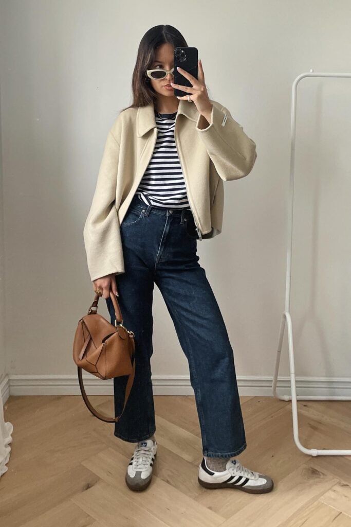 Cream Zip Up Jacket + Navy Striped T Shirt + Dark Wash Straight Jeans + White Sneakers