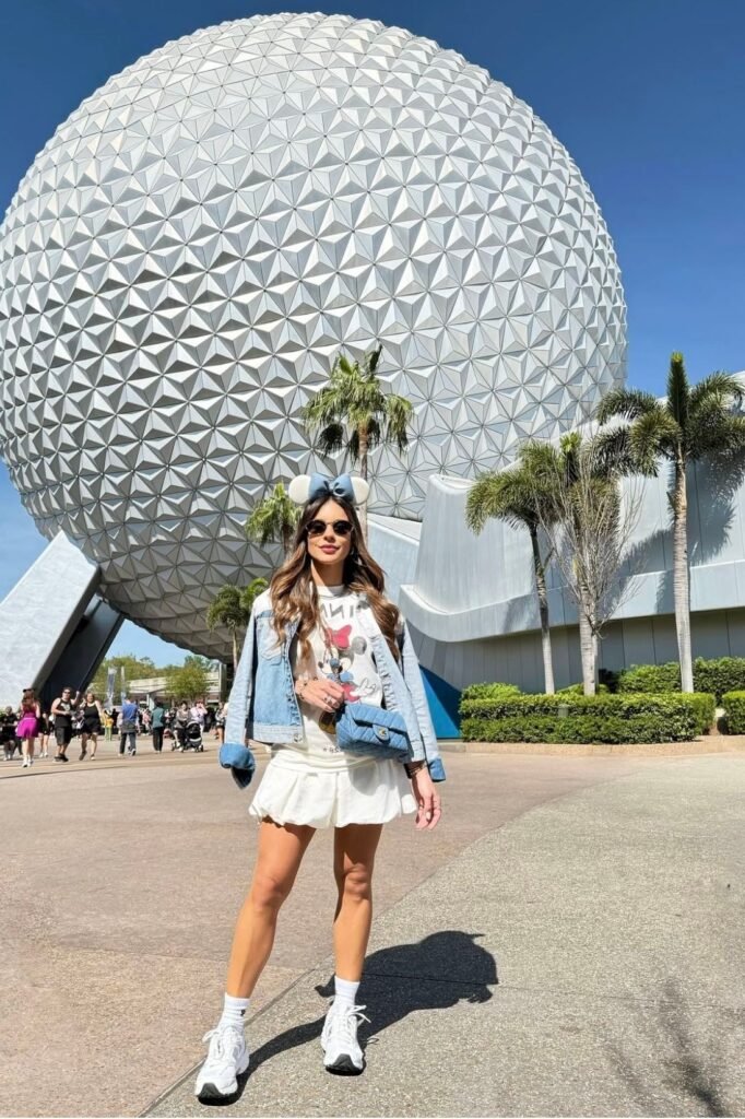 Cropped Denim Jacket + Mickey Mouse Graphic Tee + White Mini Skirt + White Sneakers