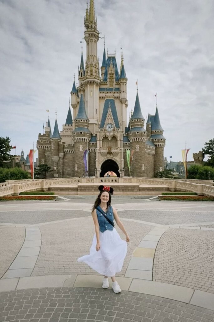 Cropped Denim Vest + White Flowy Tiered Maxi Skirt + White Sneakers + Minnie Mouse Ear Headband