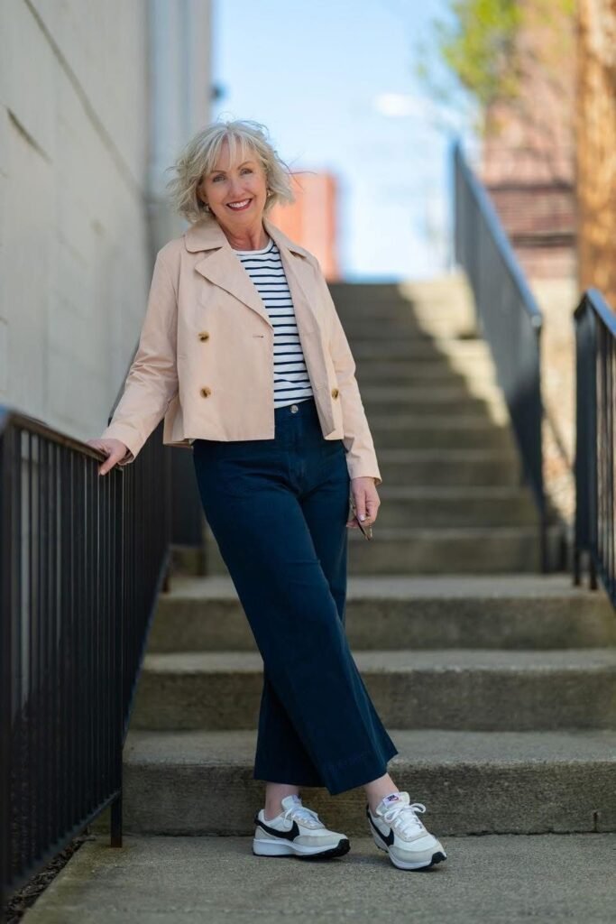 Cropped Peach Trench Jacket + Striped Tee + Navy Culottes + White Athletic Sneakers