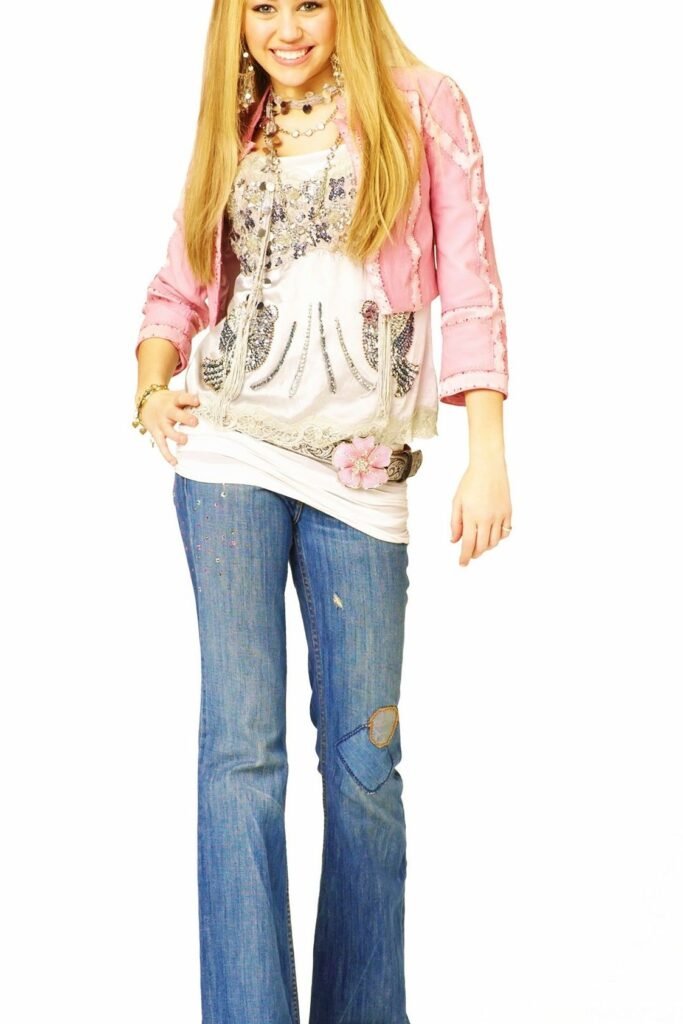 Cropped Pink Denim Jacket + Embellished White Graphic Tunic + Flared Blue Jeans + Pink Flower Belt