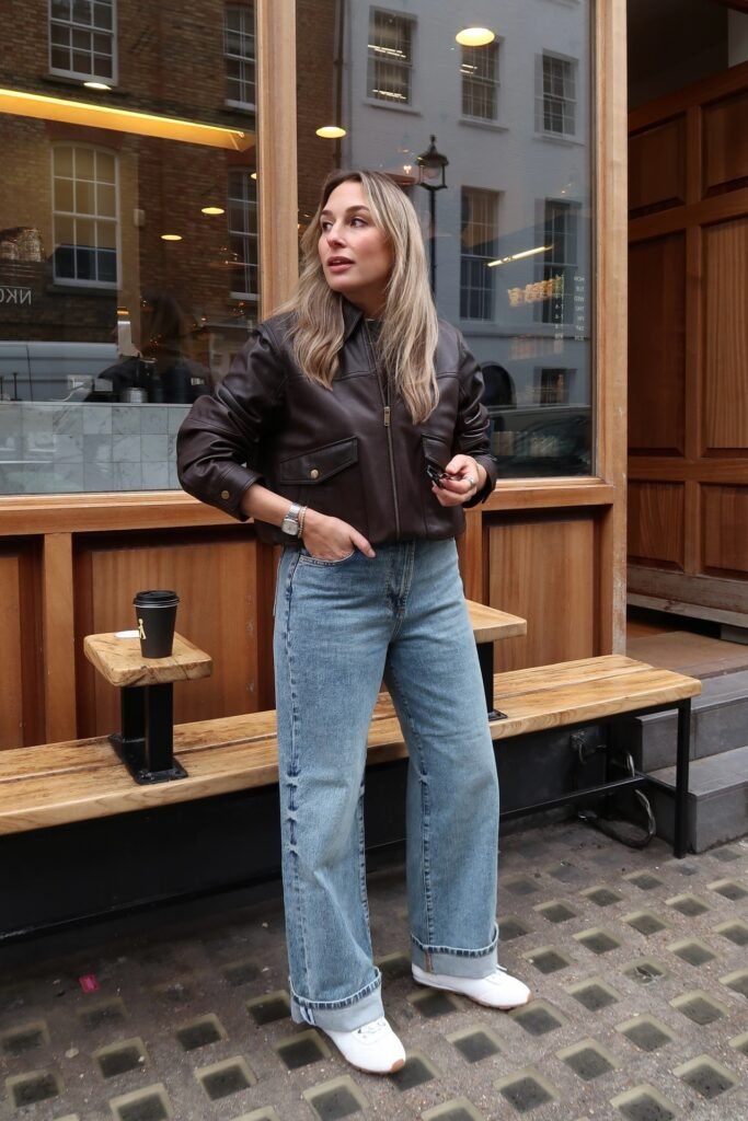 Dark Brown Faux Leather Bomber Jacket + Medium Wash Wide Leg Jeans + White Sneakers