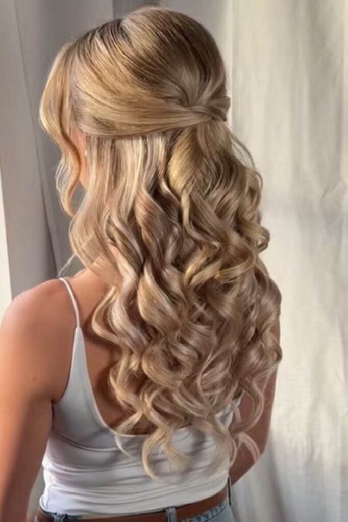 Elegant Half-Up Tucked Style with Defined Honey Blonde Curls