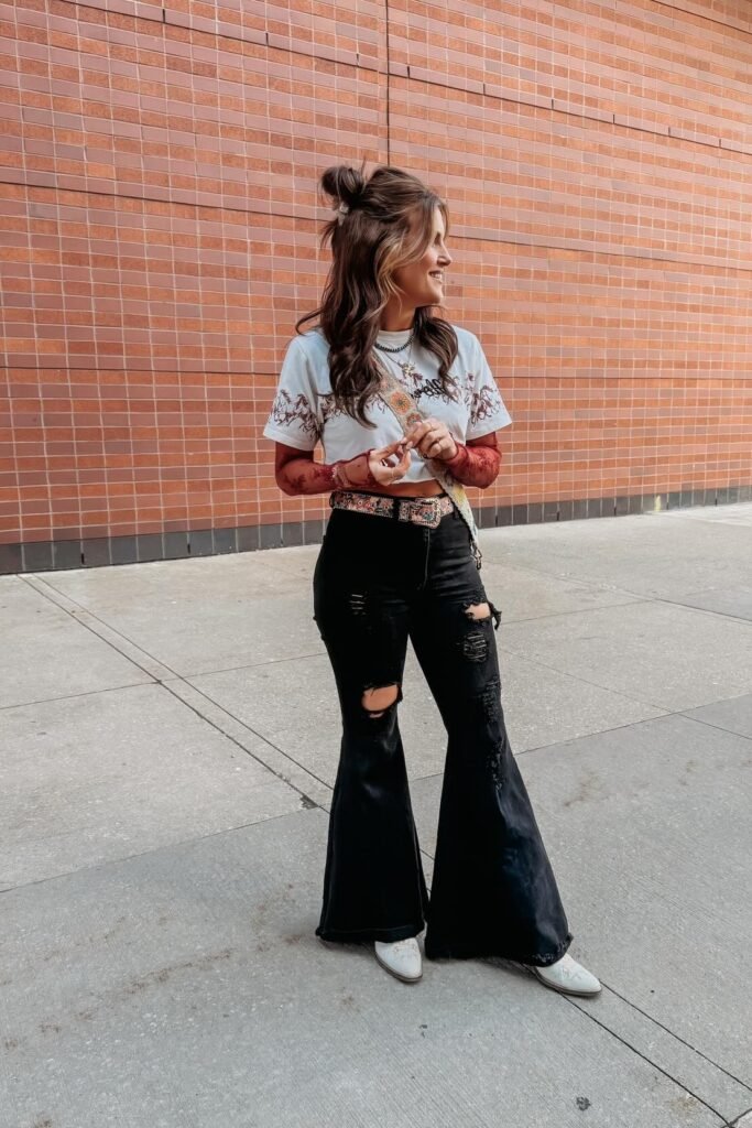 Graphic T Shirt + Red Sheer Mesh Long Sleeve Top + Black Ripped Flared Jeans + White Boots