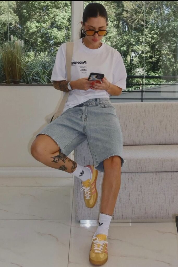 Graphic White T-Shirt + Light Wash Denim Jorts + Yellow Sneakers