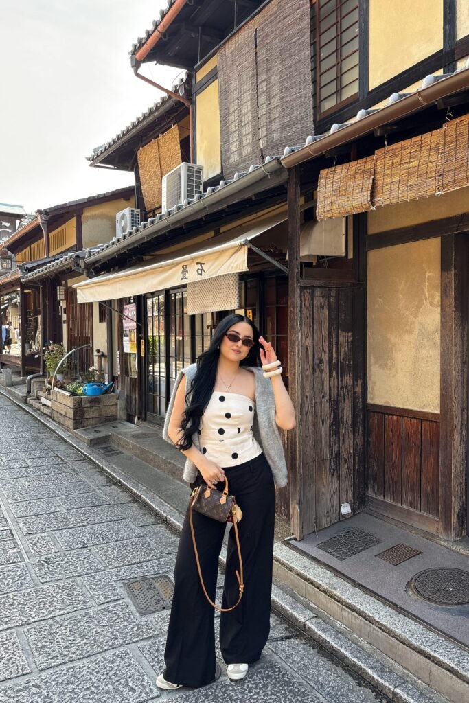 Grey Shoulder Draped Cardigan + White Polka Dot Tube Top + Black Wide Leg Trousers + White Sneakers
