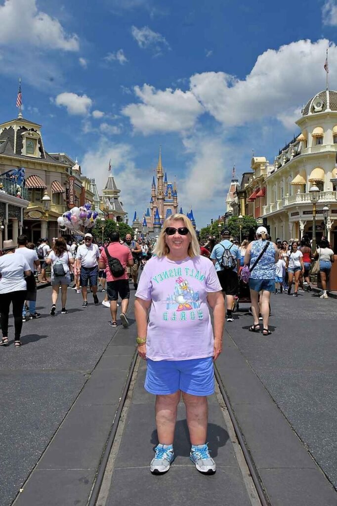 Lavender Graphic T Shirt + Blue Shorts + Grey and Blue Sneakers