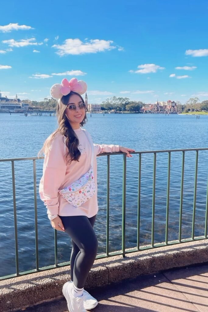 Light Pink Oversized Sweatshirt + Black Leggings + White Platform Sneakers + Pink Bow Mouse Ears + Patterned Belt Bag