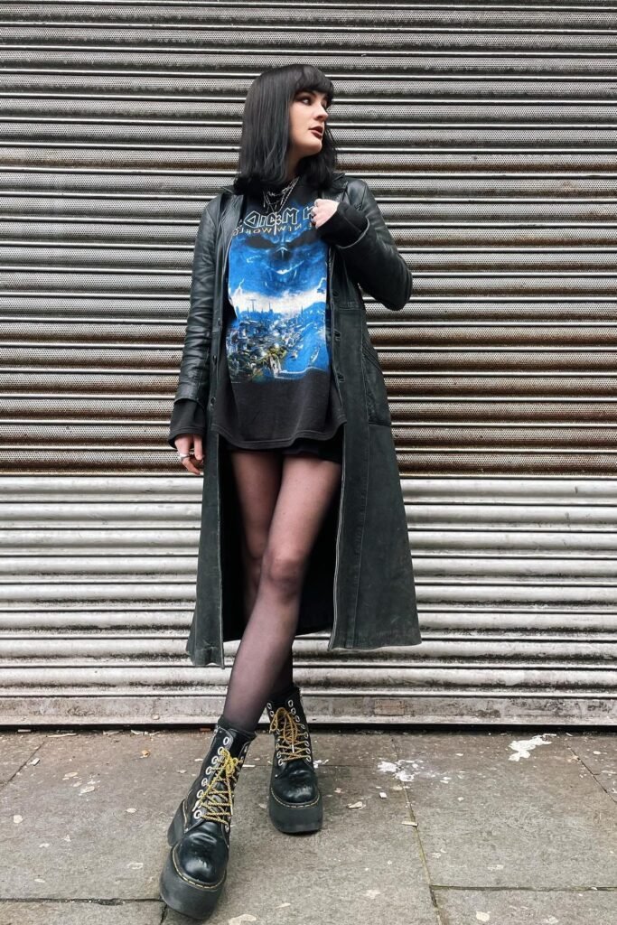 Long Black Leather Trench Coat + Iron Maiden Graphic T Shirt + Sheer Black Tights + Black Platform Combat Boots