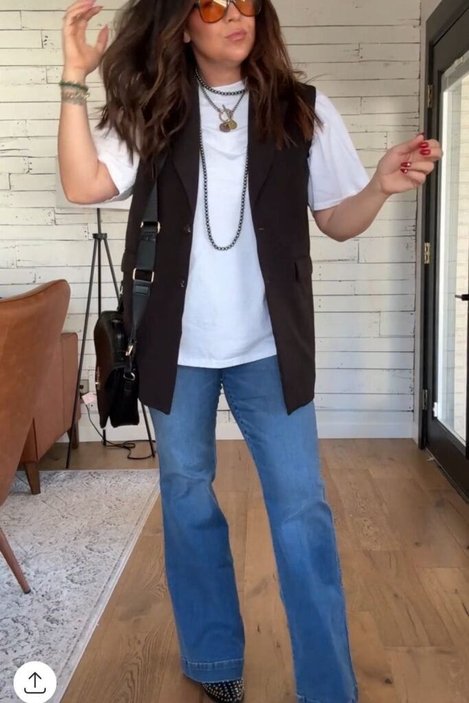 Long Black Vest + White T Shirt + Light Blue Flared Jeans