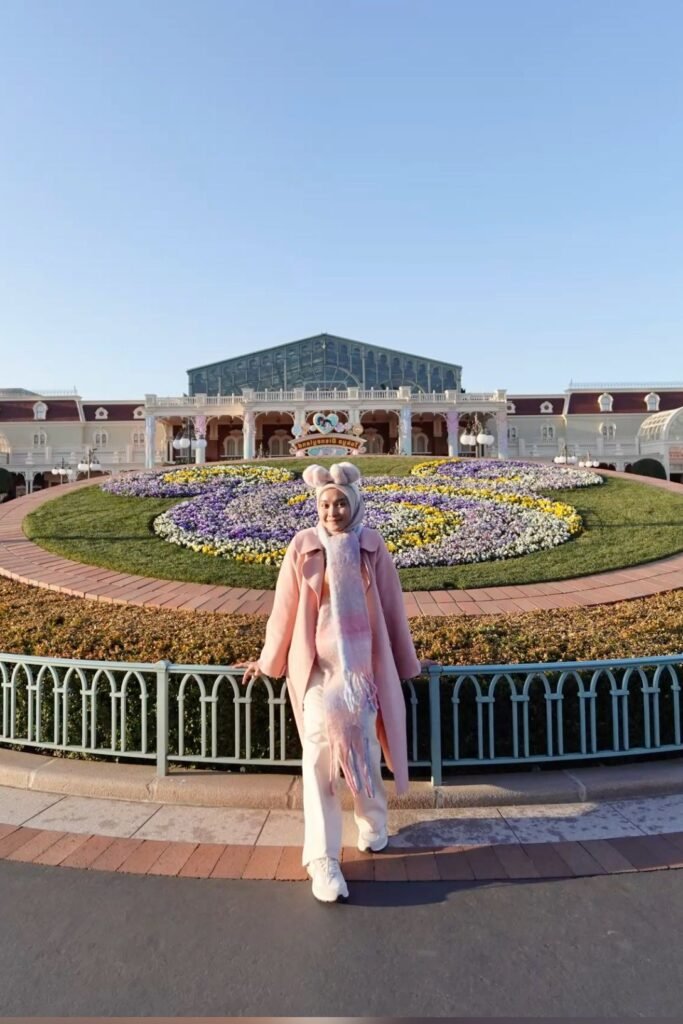 Long Pink Trench Coat + White Straight Leg Trousers + Pastel Multi Colored Scarf + White Sneakers