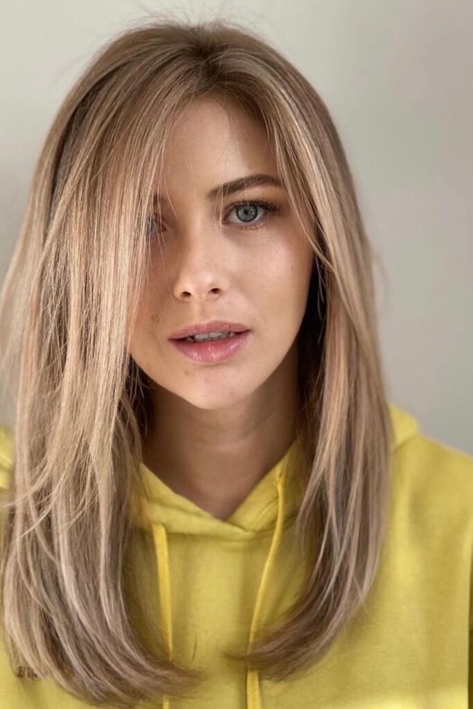 Long Straight Hair with Subtle Layers and Face-Framing Strands