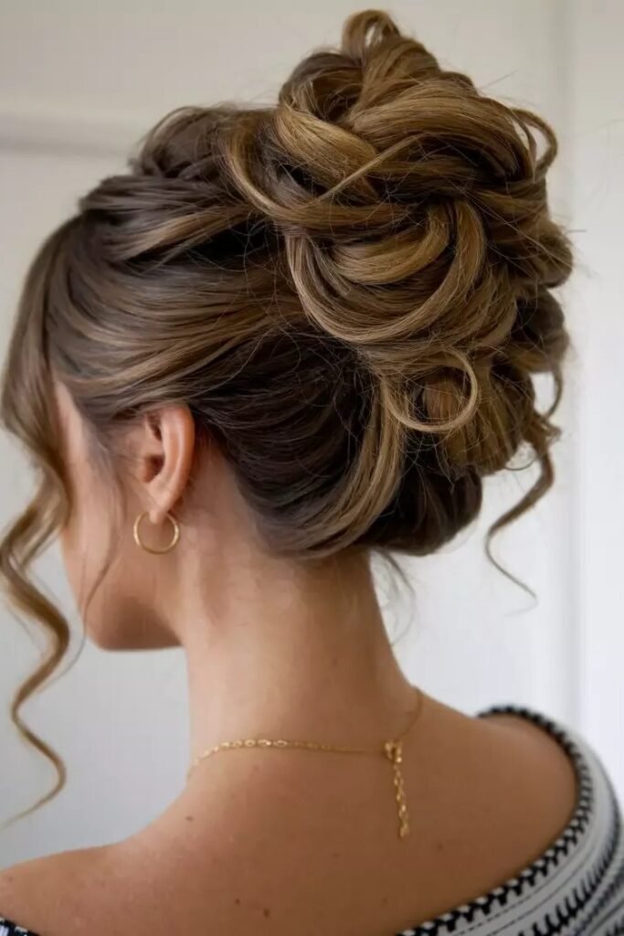 Loose Braided Low Bun with Wispy Face-Framing Strands