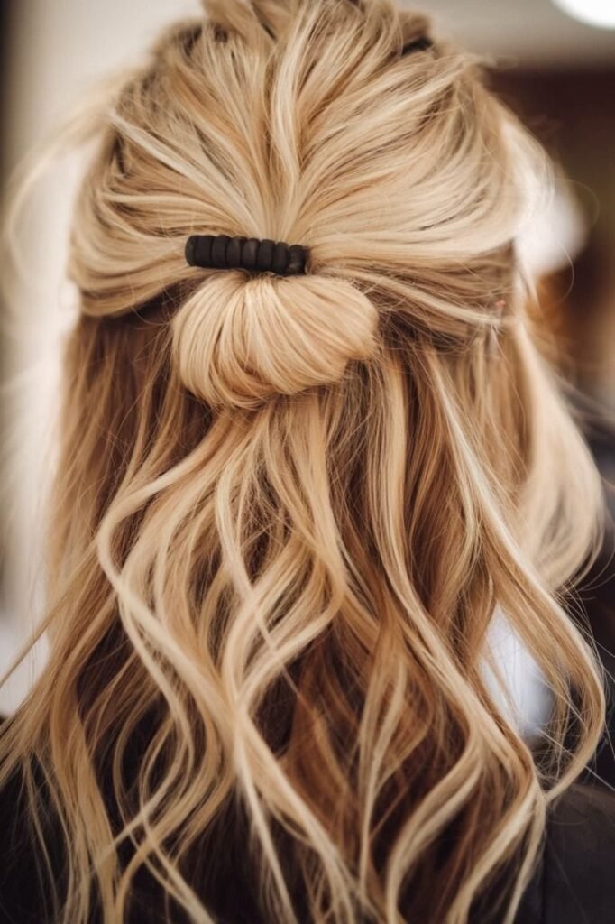 Messy Half-Up Top Knot Bun on Textured Bleach Blonde Hair