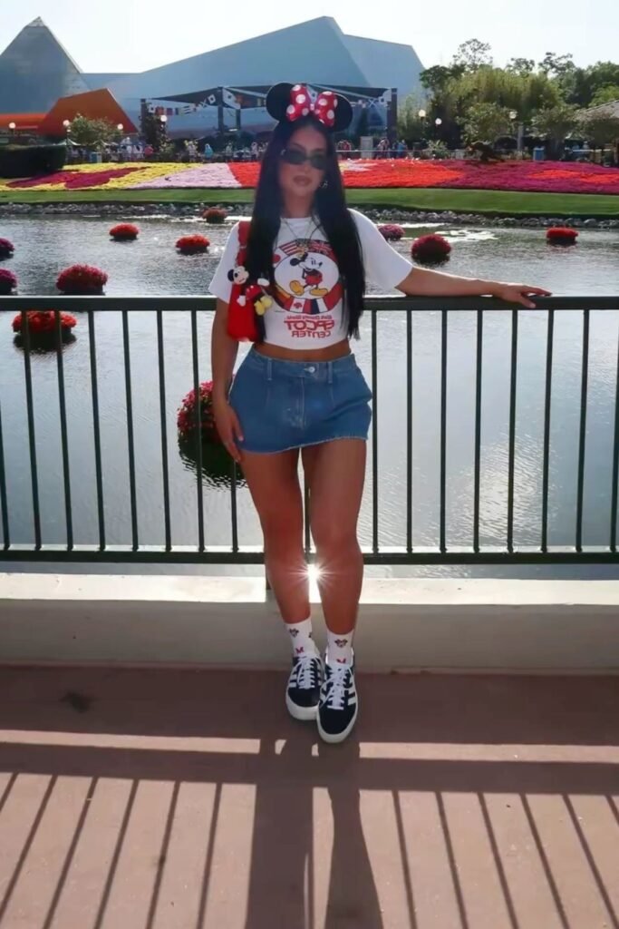 Mickey Mouse Crop Tee + Denim Mini Skirt + Graphic Socks + Black and White Sneakers