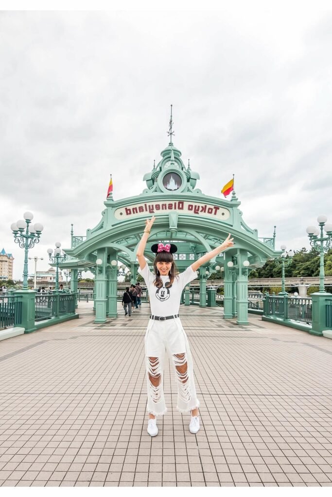 Mickey Mouse Graphic Tee + White Ripped Flare Jeans + White Sneakers