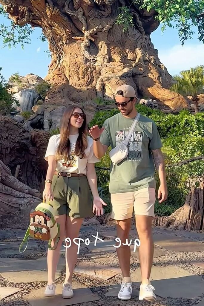 Mickey Mouse Pocket Tee + Olive Green Pleated Shorts + Brown Leather Belt + White Sneakers
