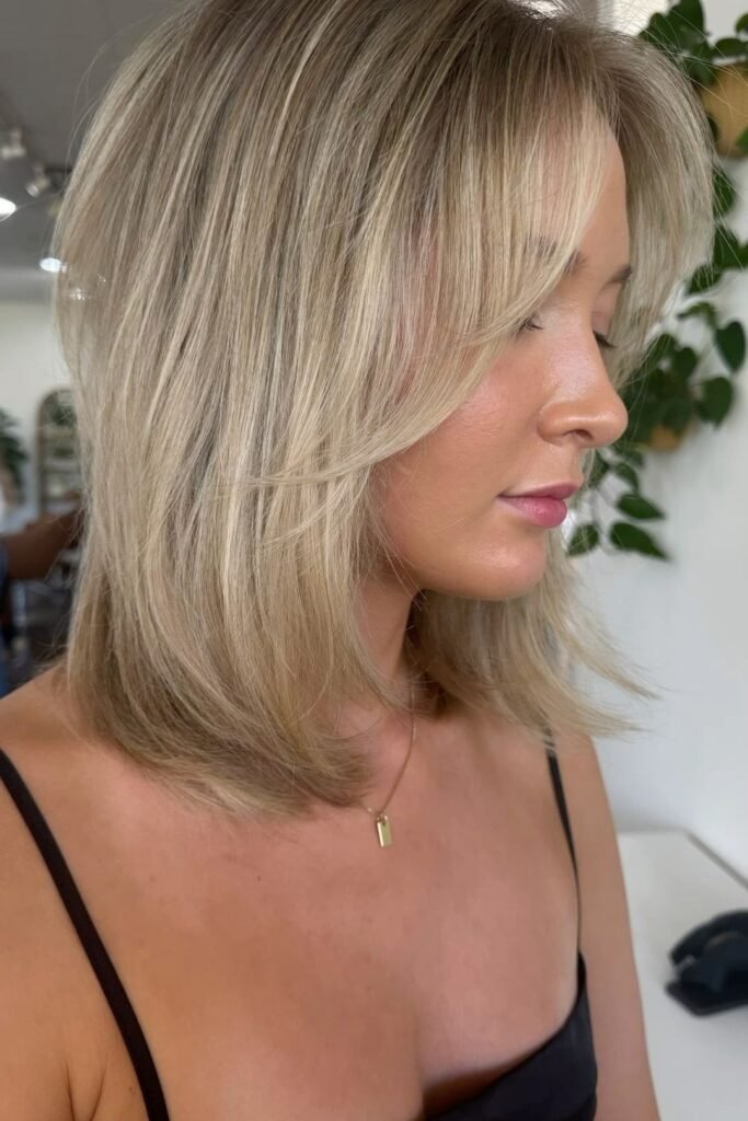 Mid-Length Layered Cut with Soft Curtain Bangs