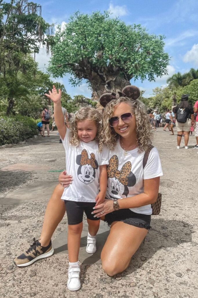 Minnie Mouse Leopard Bow Tee + Black Biker Shorts + Black and Tan Sneakers