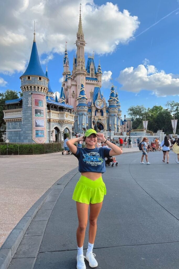 Monsters University Graphic Tee + Neon Green Athletic Skirt + Neon Green Baseball Cap + White Athletic Sneakers