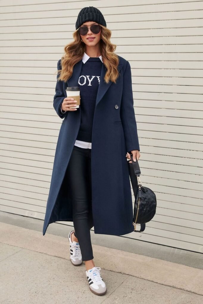 Navy Coat + Navy Graphic Sweater + White Shirt + Black Skinny Jeans + White Sneakers